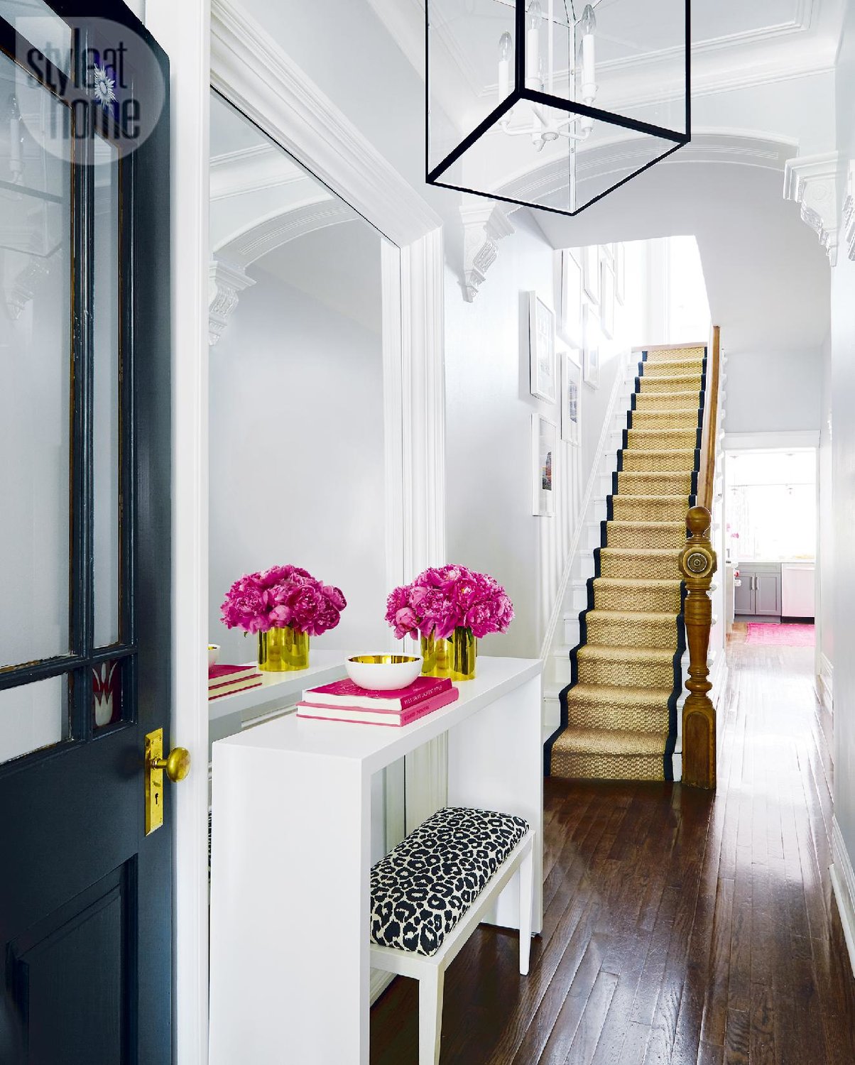 black-front-door-entryway-entrance-hallway-ideas-how-to-decorate-narrow-leopard-cicil-carpet-all-white-lantern-lighting-inspiration-small-townhouse-decor-shop-room-ideas