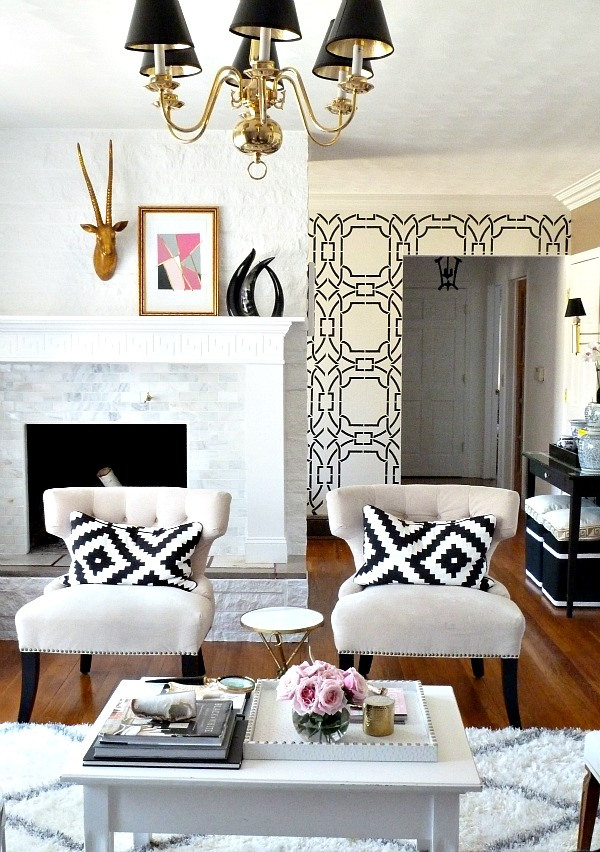 greek-key-abstract-print-pillow-black-and-white-family-room-chandelier-design-inspiration-sophisticated-modern-girly-eclectic-marble-fireplace-geometric-wallpaper-shop-room-ideas