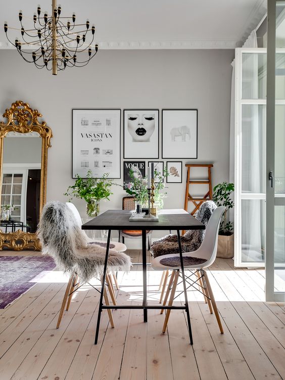 french parisian apartment gold mirror leaning wall scandinavian chairs modern look apartment loft light hardwood floors